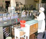 The production line where the bottles get labelled and accumulated in crates